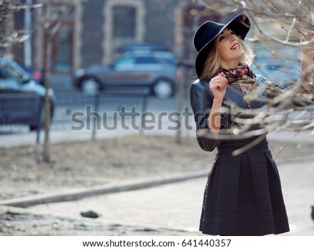 Portrait of the charming blonde on the street.