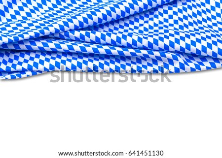 Oktoberfest background  frame  with bavarian white and blue fabric isolated on white. October fest background. Bavaria State flag fabric, copy space