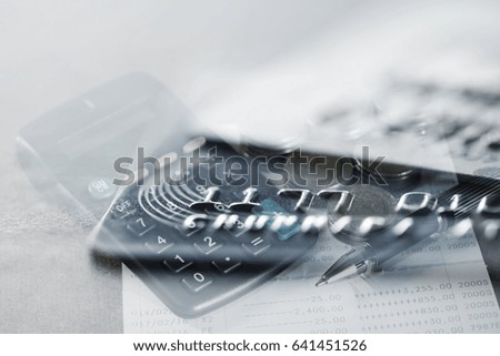 Double exposure Rows of coins,Credit cards,calculator on the table,finance and business concept,Money,soft focus and blurred style,dark tone.

