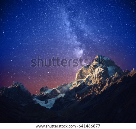 Beautiful starry night and Ushba mountain. Stylized image. Svaneti, Georgia, Europe.