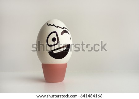 Eggs emotion concept. Winks. Flirts. Photo for your design