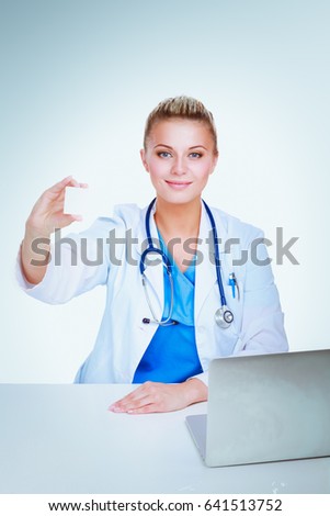 Female doctor working isolated on white background