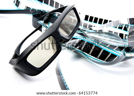 3D shutter glasses on film strip, 3-d experience Royalty-Free Stock Photo #64153774