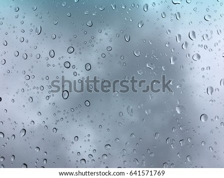 Water drop on car glass. Rain drop on clear windown. Water drop on glass surface.
