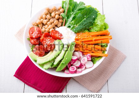 Buddha bowl on white wooden background. Vegetarian, healthy, detox food concept. Top view
