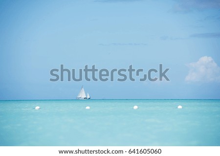 Beautiful Turquoise Water of Caribbean Sea and Blue Sky with Clouds