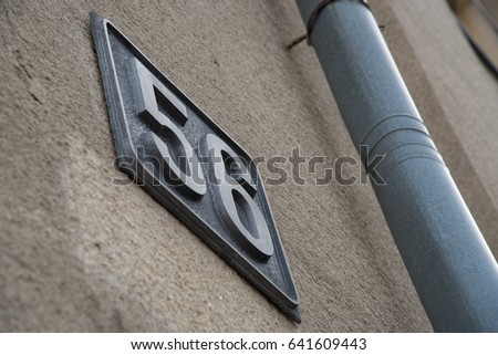 The number on the house is fifty-six and the pipe. Black letters are used as captcha