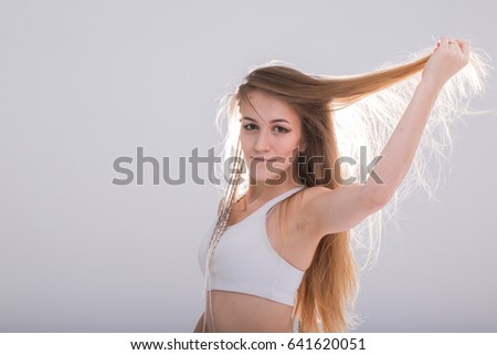 Portrait of a nice girl with long blonde hair