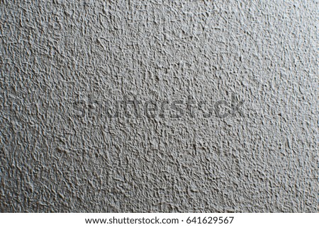 Rough and bumpy white background texture with shadows. Grunge. 