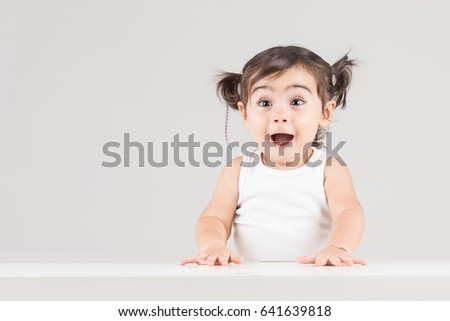 Happy and surprised child girl with excited expression Royalty-Free Stock Photo #641639818
