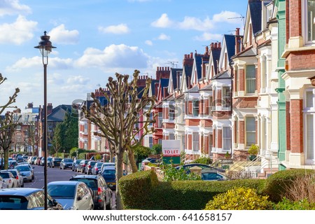 Row of typical English terraced houses in West Hampstead, London