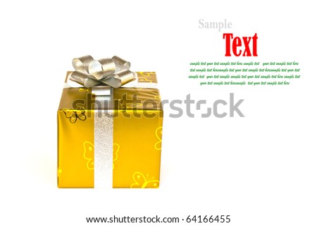 Golden gift box decorated with silver ribbon isolated on white background.