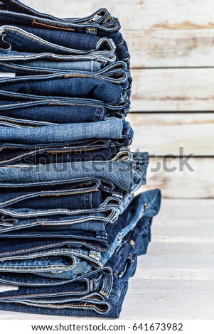 Jeans on wooden background