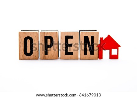 Open House - wooden block letters with red house icon - white background
