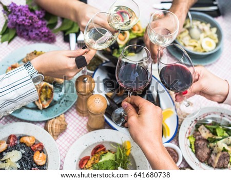 Food Table Healthy Delicious Organic Meal Concept. Enjoying dinner with friends. Top view of group of people having dinner together while sitting at the rustic wooden table Royalty-Free Stock Photo #641680738