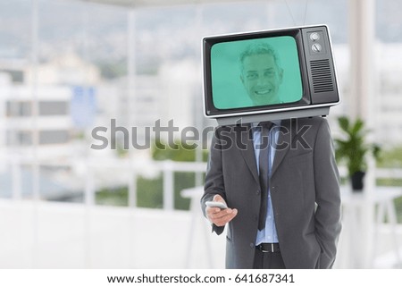 Digital composite of Composite image of businessman and television