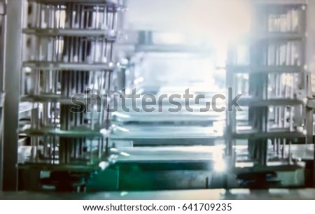 Abstract, blurred, bokeh background, image for the background. Factory for production of mobile phones.