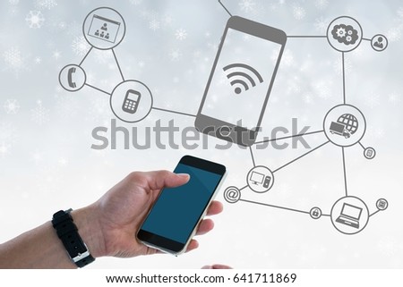 Digital composite of Digital composite image of hand holding smart phone with connection graphics in background