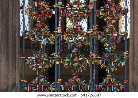 love locks or love padlocks on a fence in Basel, Switzerland