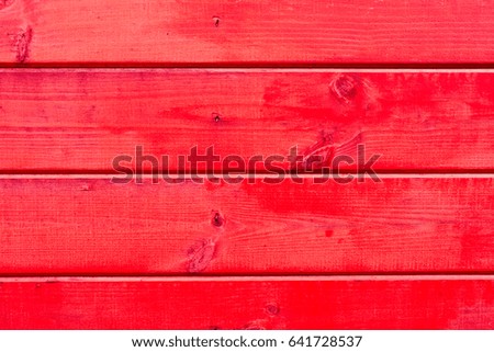 Red color wooden house wall. Textures and patterns of natural wood. Background for interiors