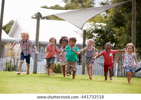 Children At Montessori School Having Fun Outdoors During Break Royalty-Free Stock Photo #641732518