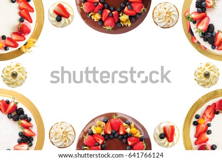 Frame of cakes and cupcakes with chocolate, strawberries, blueberries, blackberry and physalis isolated on white background. Top view. Greeting card. Picture for a menu or a confectionery catalog.
