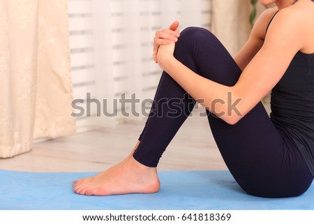 Yoga at home. Keep calm. Attractive young woman