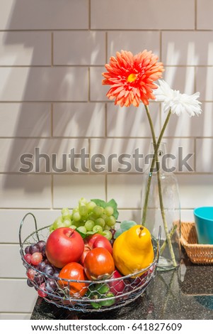 Beautiful flower in glass vases with fruit basket decoration