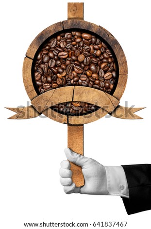 Hand of a waiter holding a wooden sign with roasted coffee beans inside and a copy space. Isolated on white background