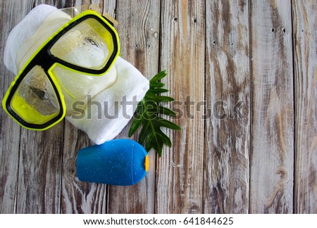 goggles towel and sun screen