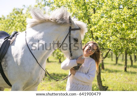 close-up portrait of teenage girl and horse.
