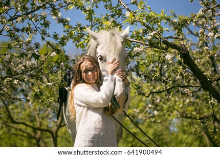 close-up portrait of teenage girl and horse.