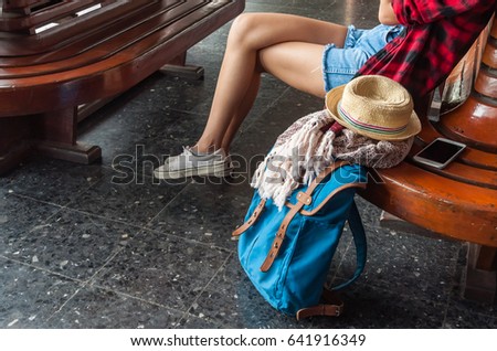 beautiful young asian girl traveling alone at train station