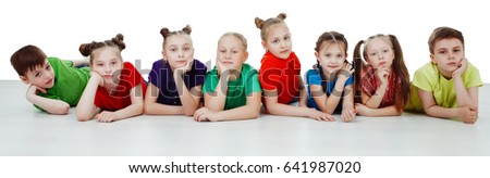 Adorable children lying on the belly, isolated on a over white background