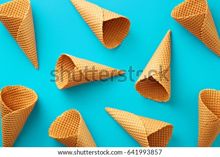 Ice cream cones pattern. Turquoise background. Sweet, summer and empty concept. Top view. Flat lay