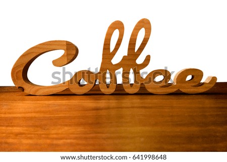 wooden coffee text on wooden table isolated on white