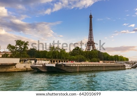 A cityscape view of sunset at Paris, view from the Seine river cruise boat, summer vacation. Paris, France.
