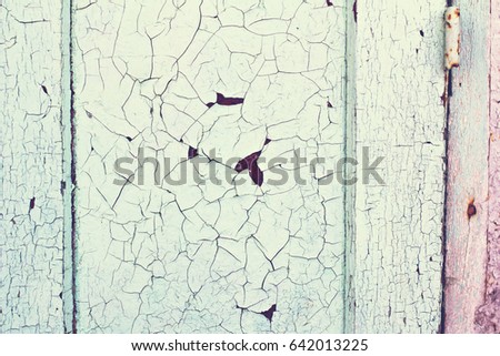 Old wooden background. Old plaques of blue color. Old rustic painted cracky green (blue) wooden texture.