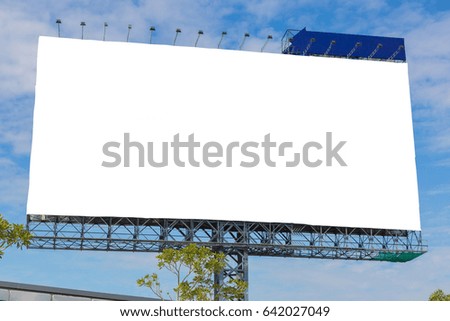 Large blank billboard with clouds and blue sky - can advertisement for display or montage product and business