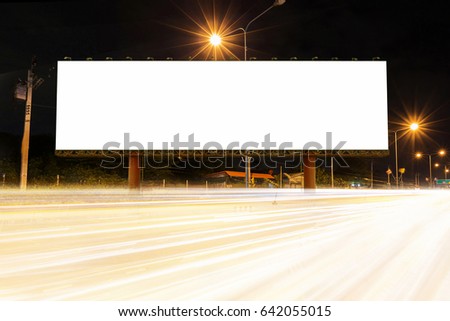 Blank billboard on light trails, street in the night - can advertisement for display or montage product or business.