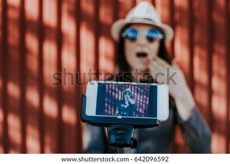 Young beautiful woman portrait making a selfie with happy expression. Lifestyle portrait.