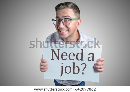 Funny laughing guy (men, student, businessman) of european appearance in casual clothes and glasses is holding a white sheet of paper with text Need a job