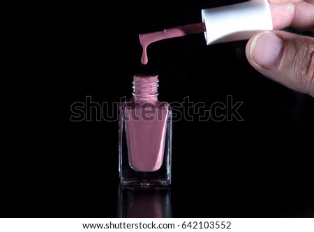 Close-up shot of nail polish in a glass bottle