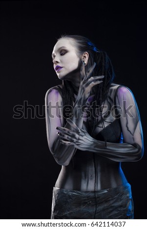 Character for computer game
Body painting cyborg, woman with pattern on body on black background