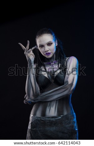Character for computer game
Body painting cyborg, woman with pattern on body on black background