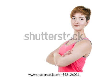 Young girl with short hair style smiling, on the right side of the frame, on white isolated background. Place for the inscription