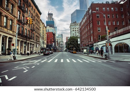 New York City street road in Manhattan at summer time. Urban big city life concept background. Royalty-Free Stock Photo #642134500