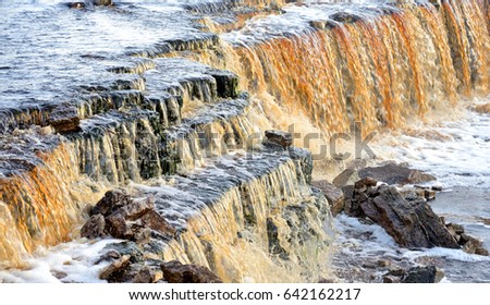 Small waterfall on Tosna River in Leningrad Region, Russia.