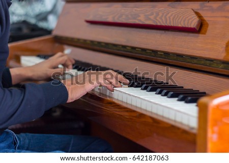 man playing piano.