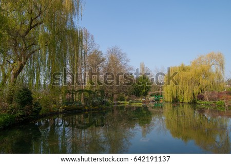 A Beautiful Pond With Reflection In The Claude Monet Garden Taken By Fisheye Lens. Oscar-Claude Monet Was A Founder Of French Impressionist Painting Living In Northern France In A Place Call Giverny.